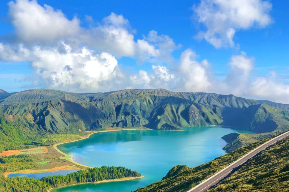 A turquoise crater lake in the green hills of the Azores